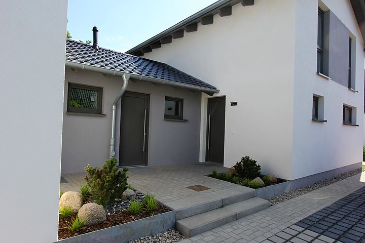Front entrance with stone bed and path