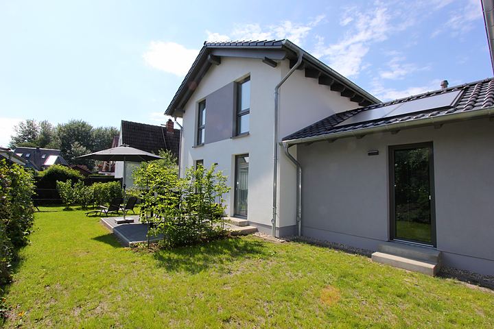 Side view of the house with lawn