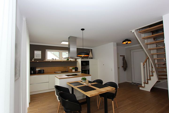 Kitchen, dining area and stairs to the upper floor