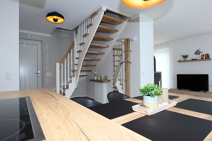 Kitchen island with view of the stairs and living room