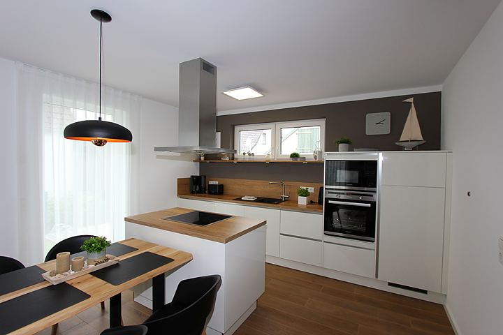 Open kitchen with island and dining table