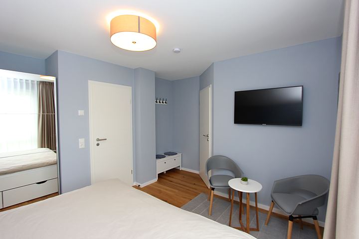 Second bedroom with double bed and seating area
