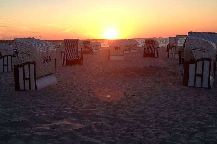 Beach chairs on Zingst beach in the evening light