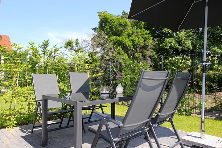 Seating area with parasol on the terrace