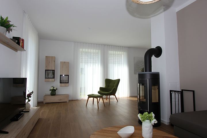 Living room with wood-burning stove and terrace door