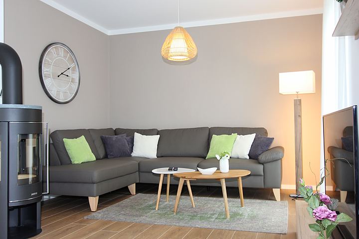 Sofa corner with coffee table and wood-burning stove